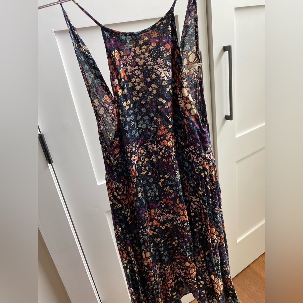 Multi color high neck with back cut out, button closure.